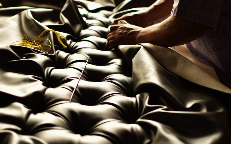 Creative,Hands,Working,On,The,Upholstery,Of,A,Capitoned,Headboard